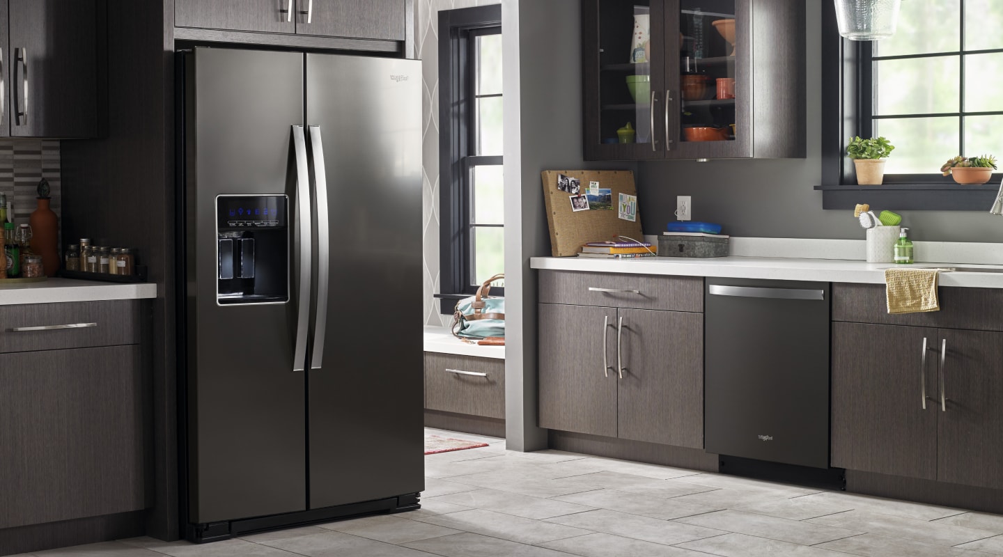 A refrigerator set in a kitchen A refrigerator set in a kitchen
