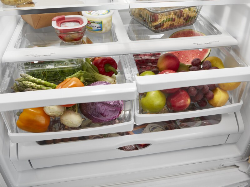 Open crisper drawers filled with food Open crisper drawers filled with food
