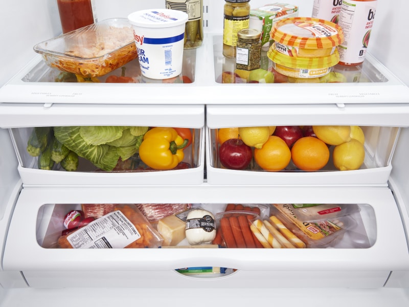 Closed crisper drawers filled with food Closed crisper drawers filled with food