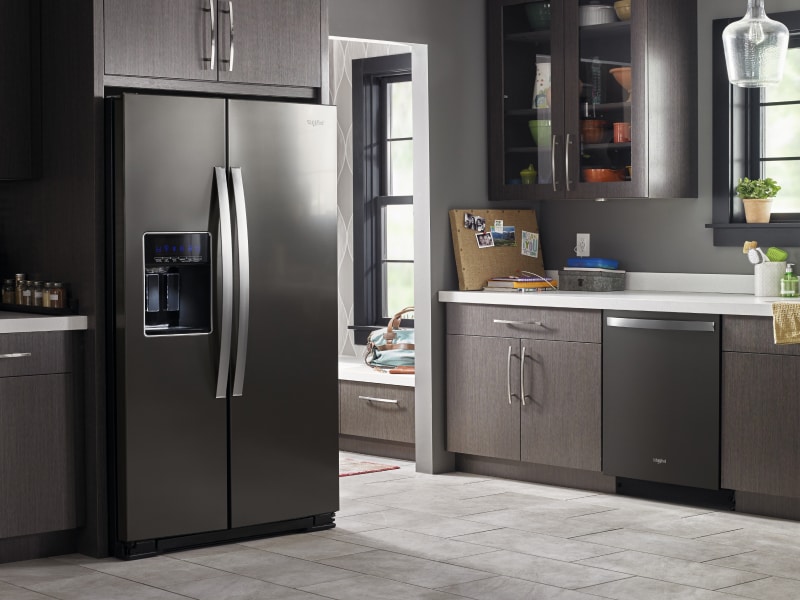 A refrigerator set in a kitchen A refrigerator set in a kitchen