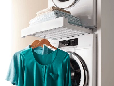 Clothing hanging from a washing machine Clothing hanging from a washing machine