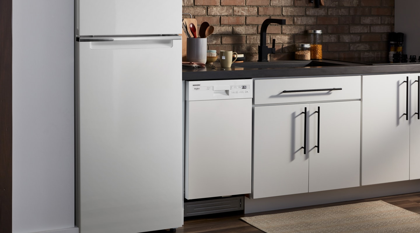 Whirlpool® refrigerator and dishwasher in a bright kitchen Whirlpool® refrigerator and dishwasher in a bright kitchen