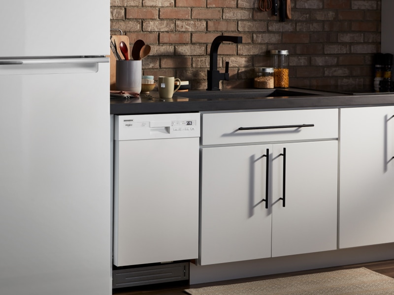Whirlpool® refrigerator and dishwasher in a bright kitchen Whirlpool® refrigerator and dishwasher in a bright kitchen