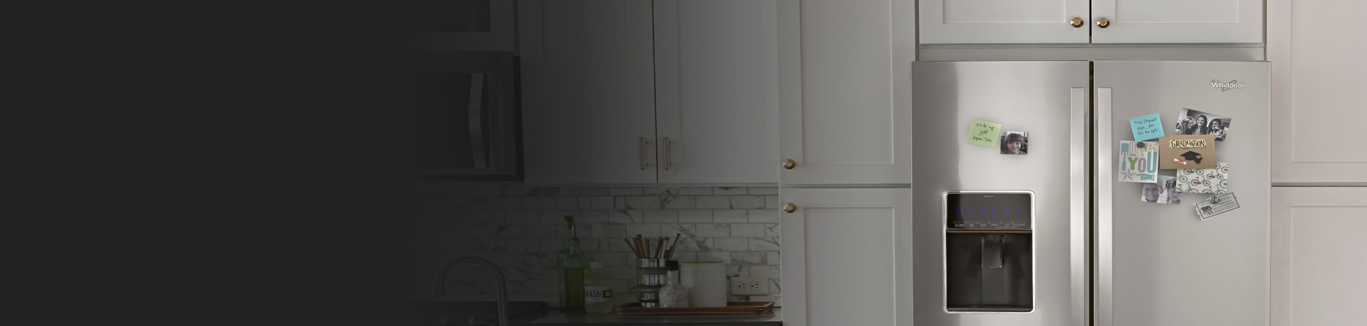 A refrigerator with a photo and note stuck onto it