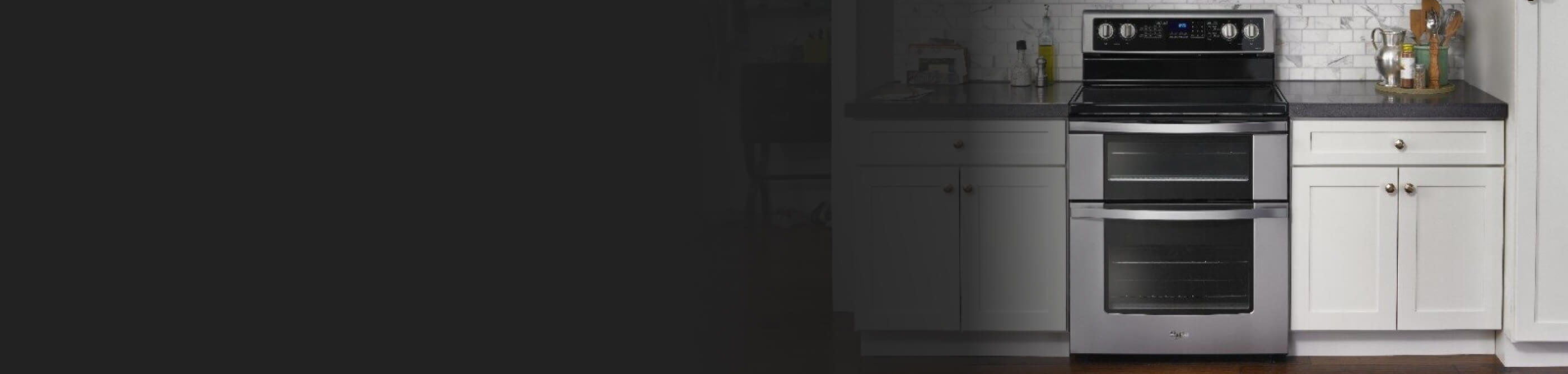 Whirlpool brand double oven range in modern kitchen