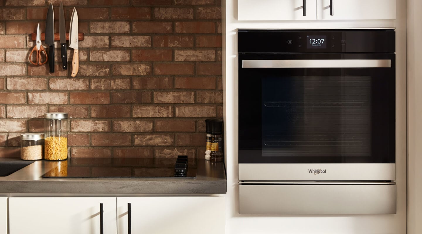 Stainless steel Whirlpool® wall oven in a rustic kitchen Stainless steel Whirlpool® wall oven in a rustic kitchen