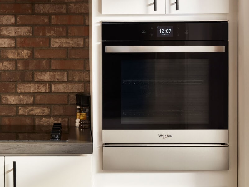 Stainless steel Whirlpool® wall oven in a rustic kitchen Stainless steel Whirlpool® wall oven in a rustic kitchen