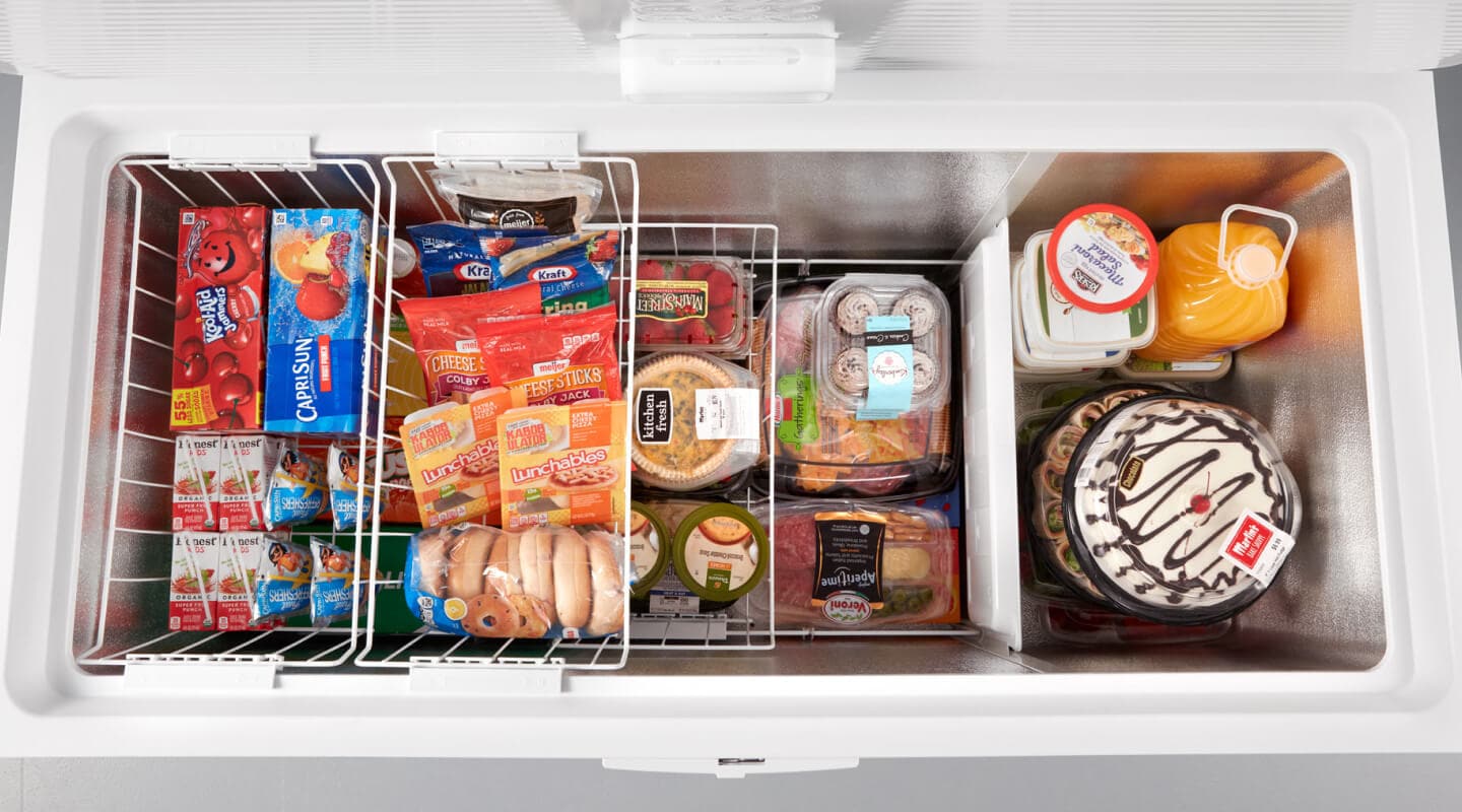 Aerial view of an open white chest freezer Aerial view of an open white chest freezer