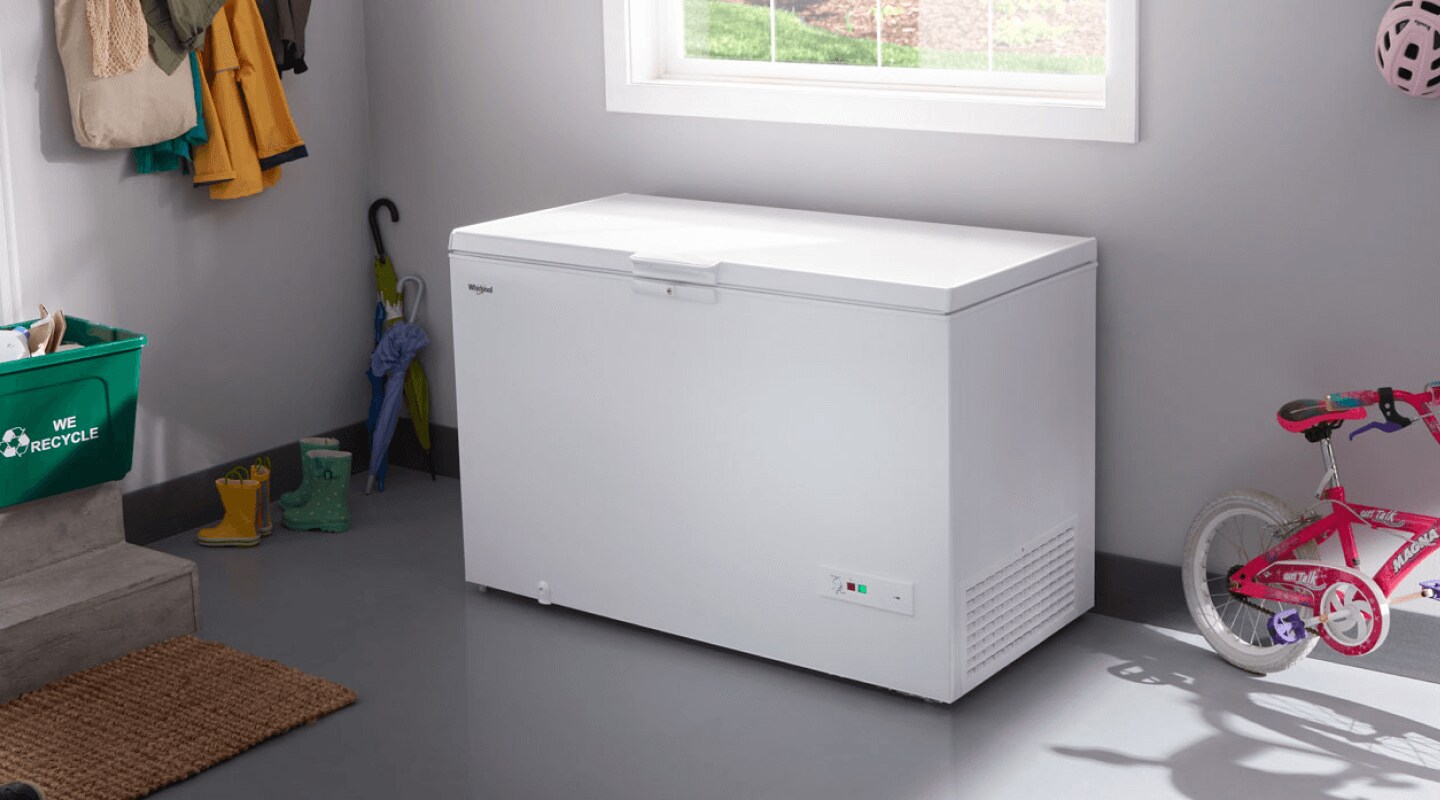 White chest freezer in a garage White chest freezer in a garage