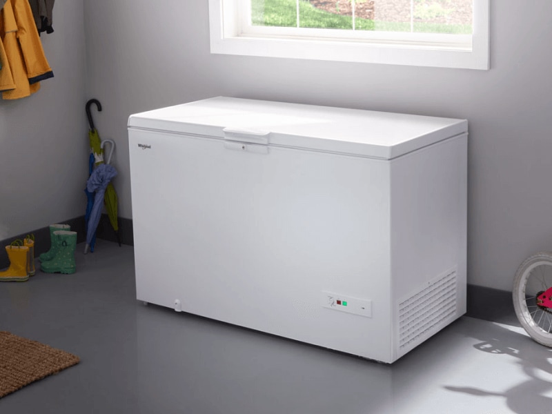White chest freezer in a garage White chest freezer in a garage