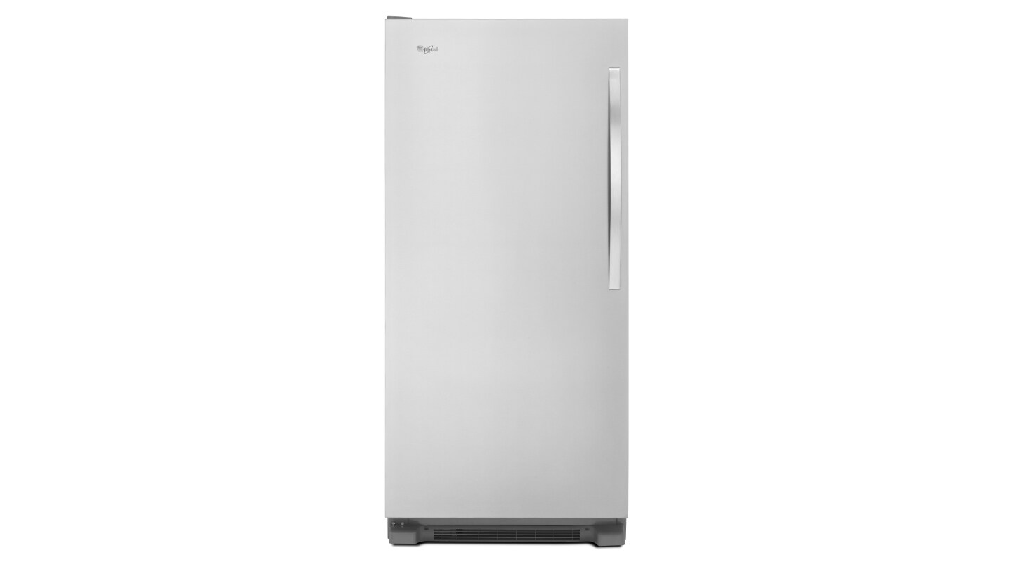 A white upright freezer against a white background A white upright freezer against a white background