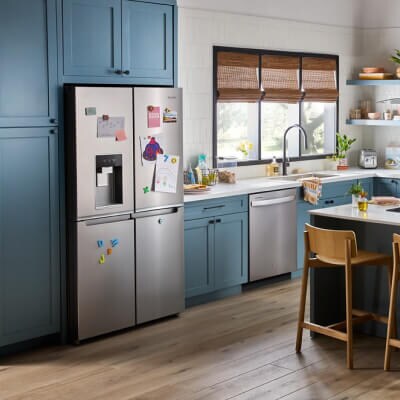 Whirlpool® 4-Door Refrigerator with external ice and water dispenser in blue cabinetry