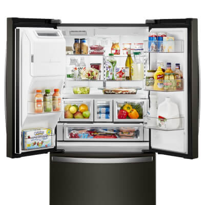 Open Whirlpool® French Door Refrigerator fully stocked with groceries