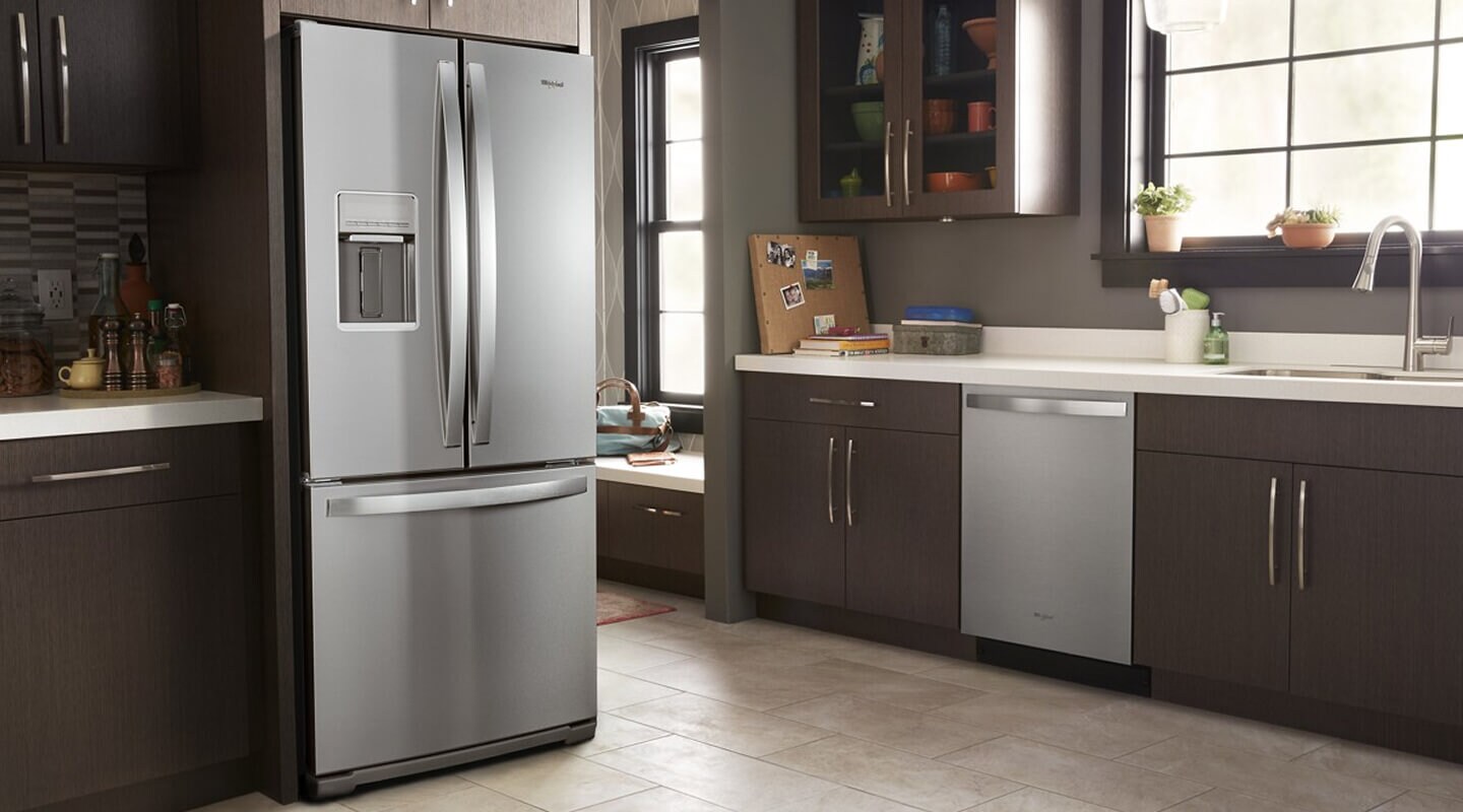 Whirlpool® appliances in a brown, modern kitchen
