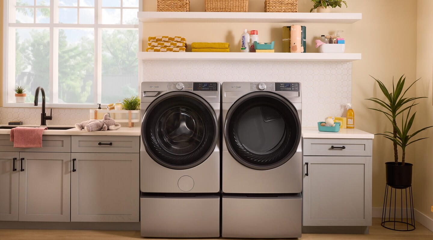 Whirlpool® front load laundry pair in light gray cabinetry