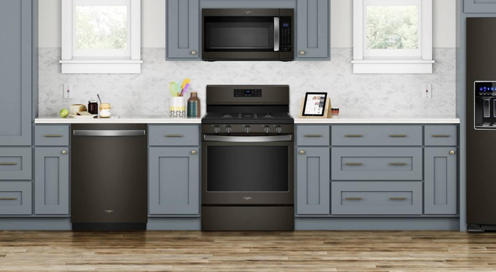 A Whirlpool® Gas Range installed in a kitchen with light blue cabinets