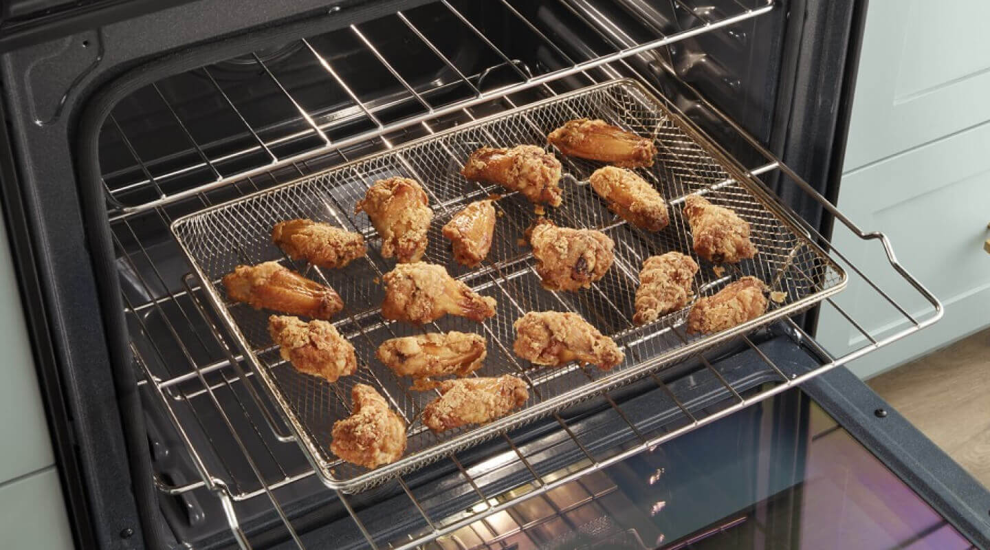 Wings on the Air Fryer Basket inside a Whirlpool® Gas Range Wings on the Air Fryer Basket inside a Whirlpool® Gas Range
