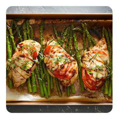 Chicken breasts and asparagus on a sheet pan