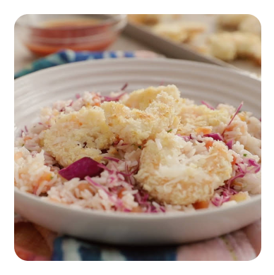 Coconut shrimp in a white dish Coconut shrimp in a white dish