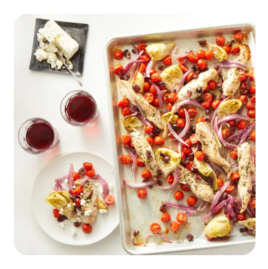 Roasted mediterranean vegetables and chicken on a sheet pan