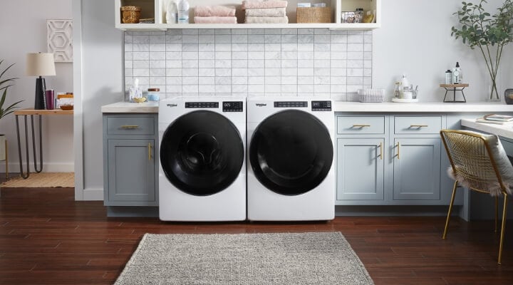 Front load washer and dryer in a utility room Front load washer and dryer in a utility room