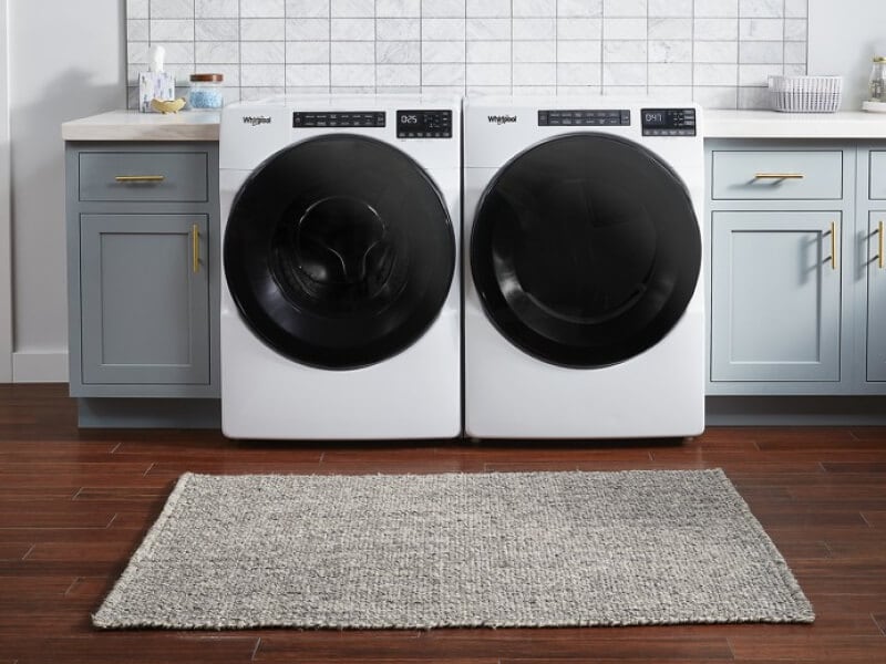 Front load washer and dryer in a utility room Front load washer and dryer in a utility room