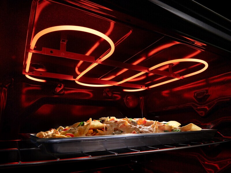 Nachos broiling in an electric oven Nachos broiling in an electric oven
