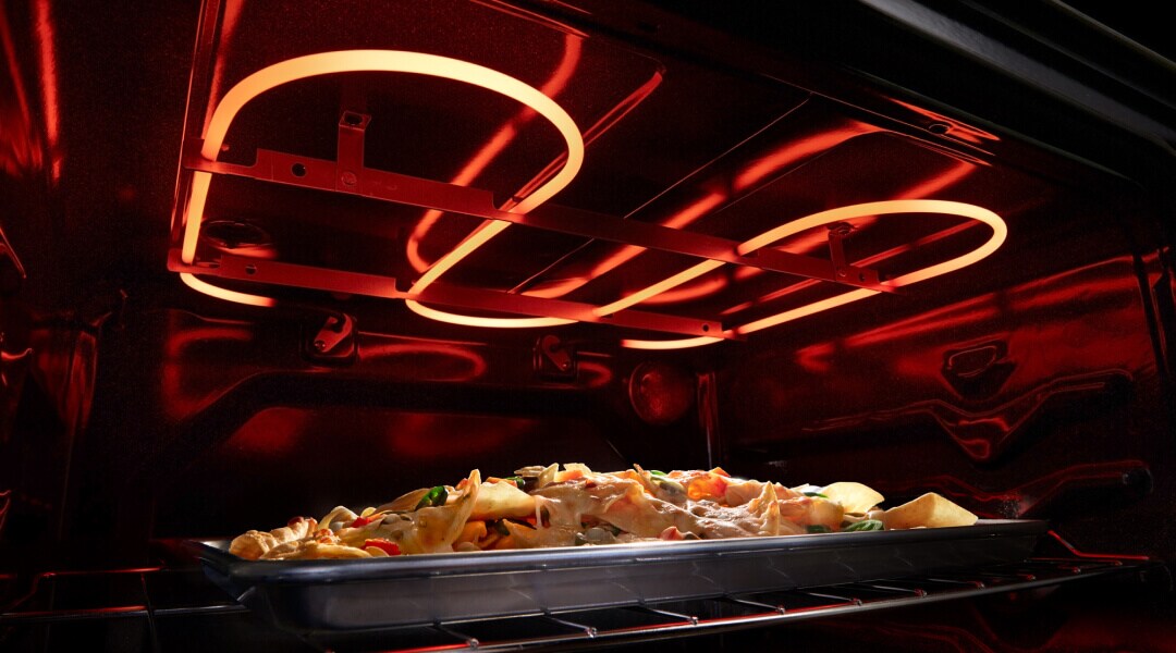Nachos broiling in an electric oven Nachos broiling in an electric oven