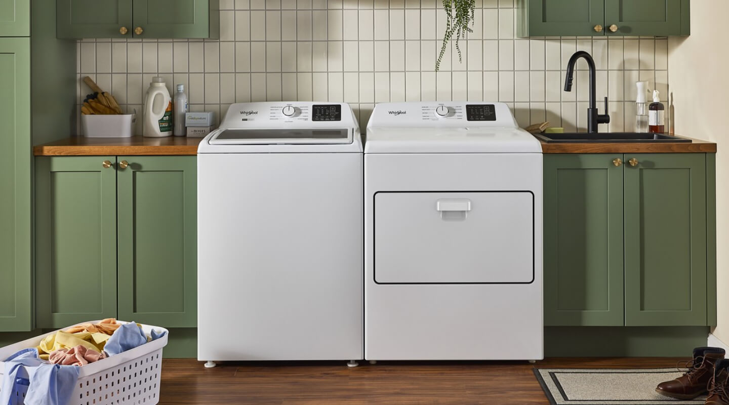 A washer and dryer side by side in a laundry room in a house