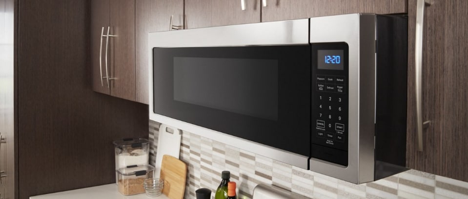 A Whirlpool® microwave installed over a range A Whirlpool® microwave installed over a range