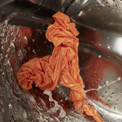 Clothes going through a drain and spin cycle