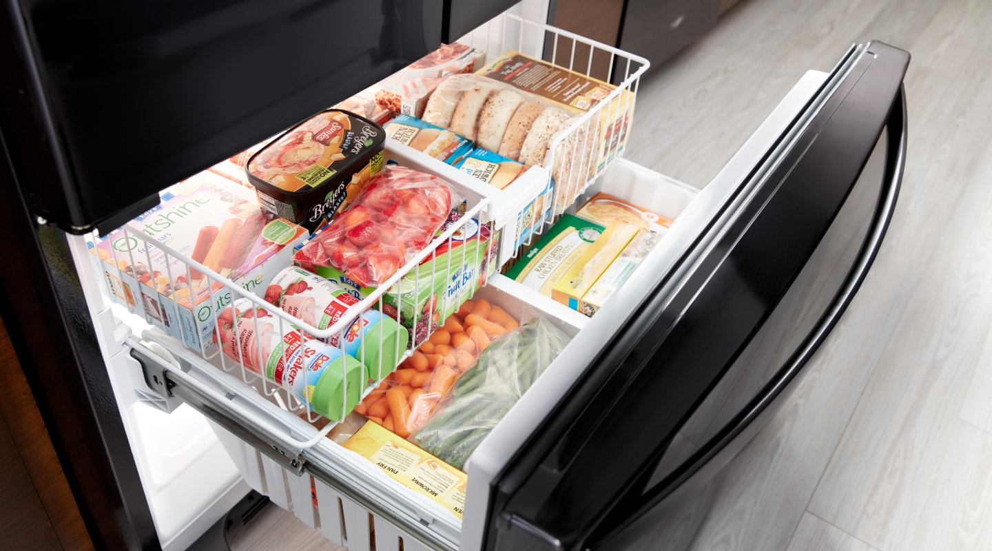 Ice cream, bread, vegetables and frozen meals organized in a freezer. Ice cream, bread, vegetables and frozen meals organized in a freezer.