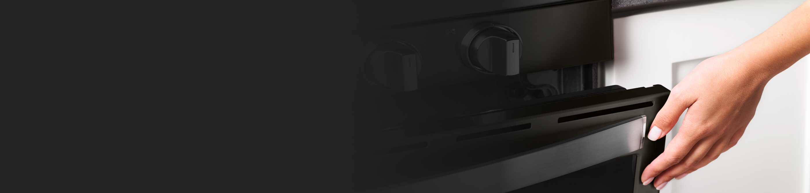 Gas range cooktop knobs and open oven door