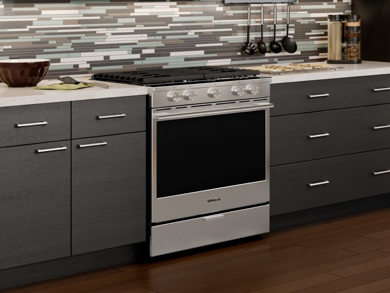 A Whirlpool® oven with Air Fry Mode in a modern kitchen. A Whirlpool® oven with Air Fry Mode in a modern kitchen.