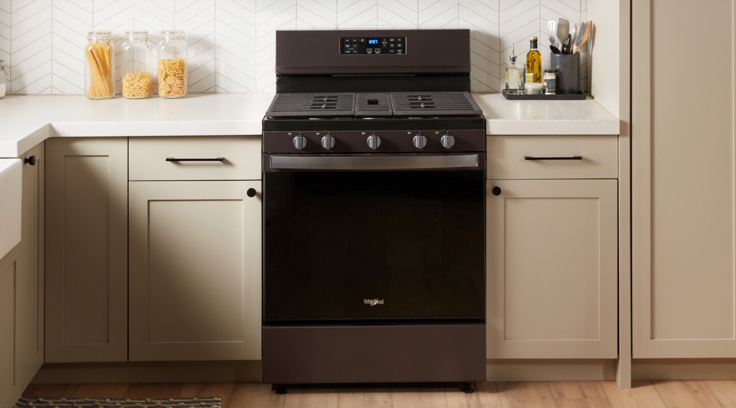 A Whirlpool® oven with Air Fry Mode in a modern kitchen. A Whirlpool® oven with Air Fry Mode in a modern kitchen.