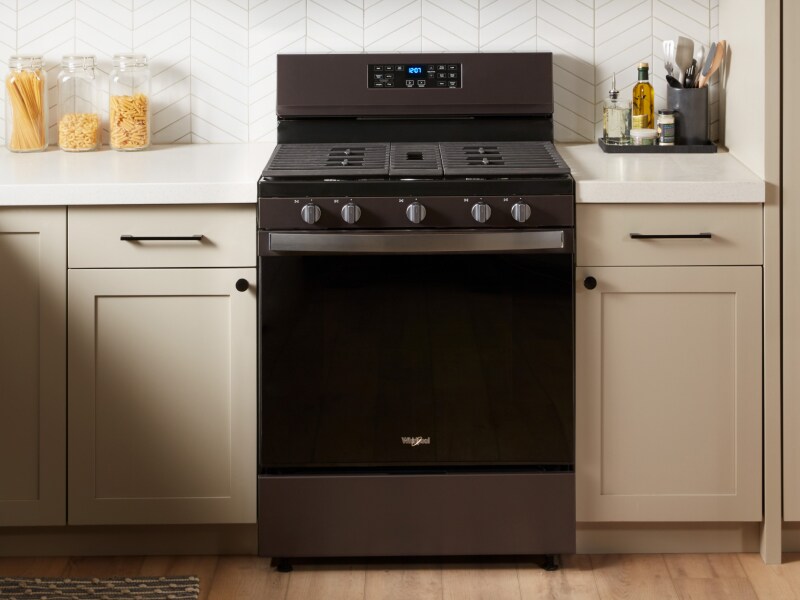 A Whirlpool® oven with Air Fry Mode in a modern kitchen. A Whirlpool® oven with Air Fry Mode in a modern kitchen.