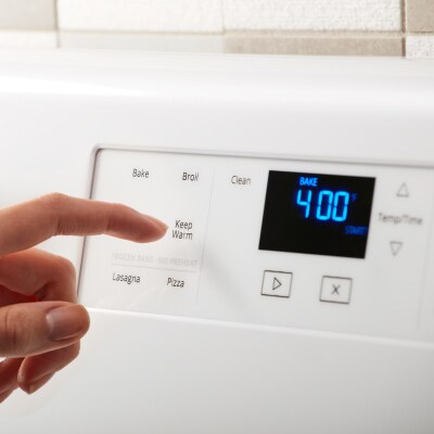 A finger pressing an analog control