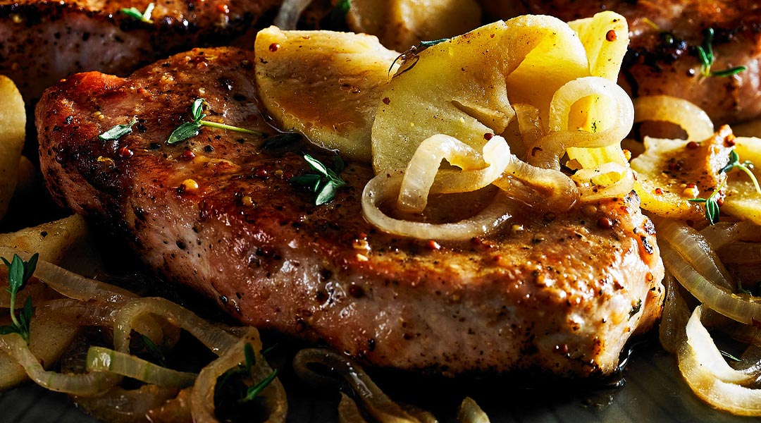 Steak with caramelized onions on top
