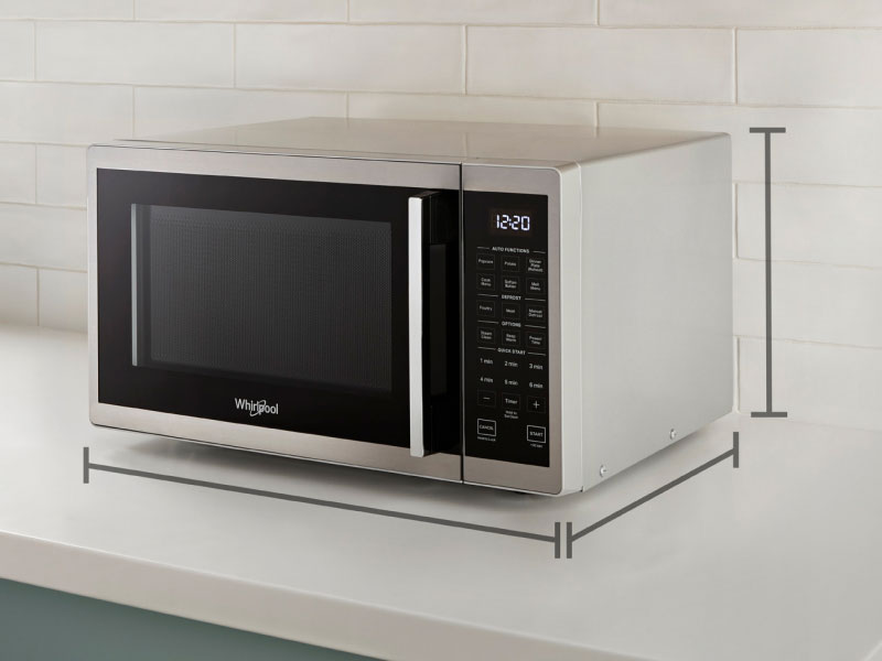 Black and silver countertop microwave with dimension markers infographic Black and silver countertop microwave with dimension markers infographic