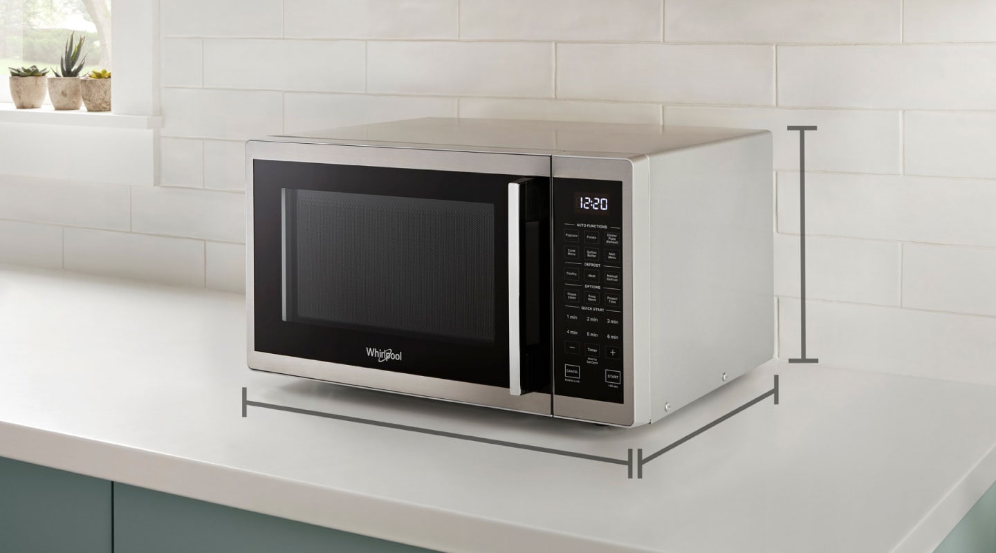 Black and silver countertop microwave with dimension markers infographic Black and silver countertop microwave with dimension markers infographic