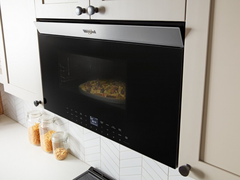 Nachos cooking inside a Whirlpool® Over-the-Range Microwave Nachos cooking inside a Whirlpool® Over-the-Range Microwave