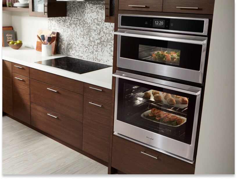 Whirlpool brand combination wall oven and microwave with food inside Whirlpool brand combination wall oven and microwave with food inside