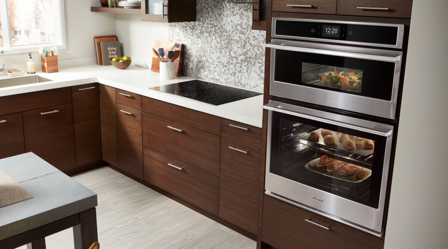 Whirlpool brand combination wall oven and microwave with food inside Whirlpool brand combination wall oven and microwave with food inside