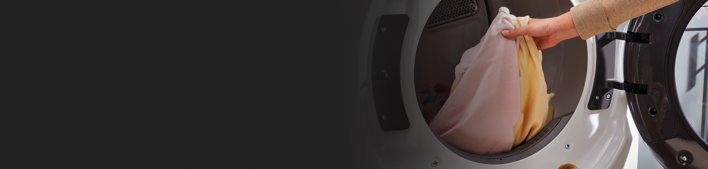 Person taking laundry out of dryer