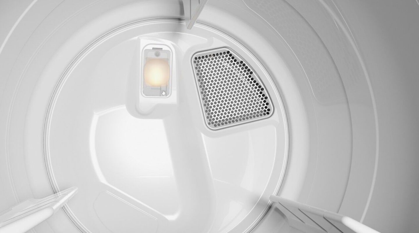Inside of white dryer drum.
