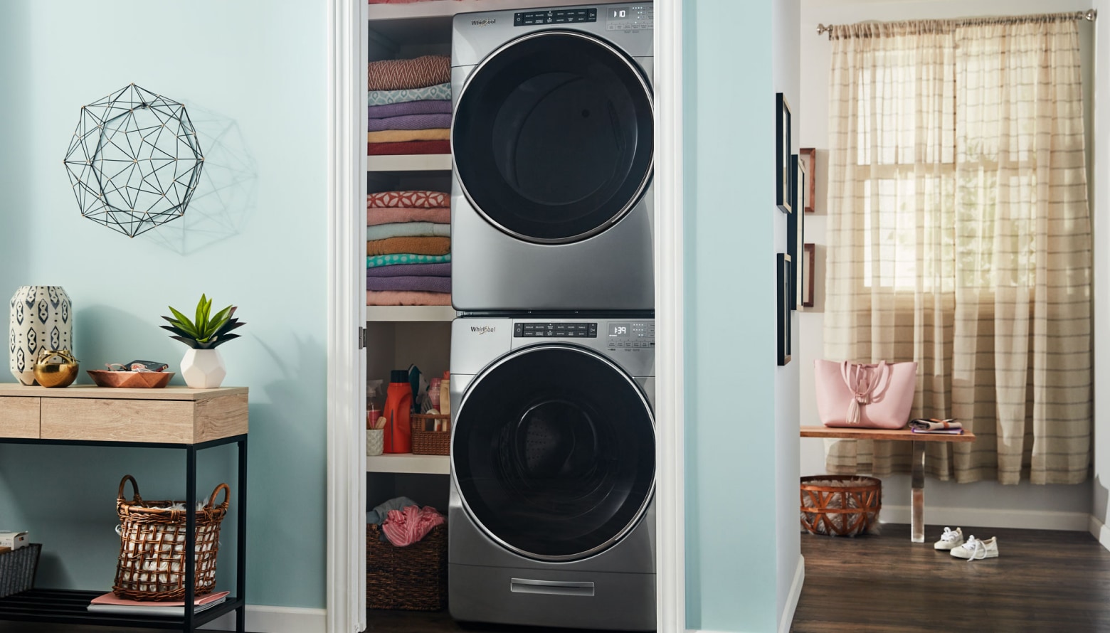 A front load washer and dryer set in a closet