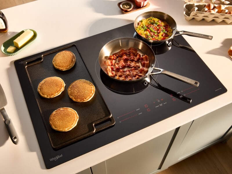 Breakfast cooking on a glass electric cooktop
