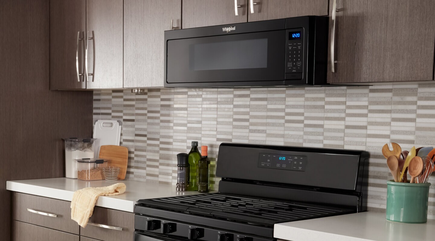 Whirlpool® Low Profile Microwave in brown cabinetry