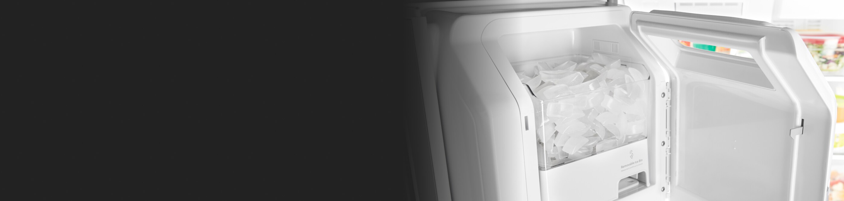 Inside of an ice maker filled with ice