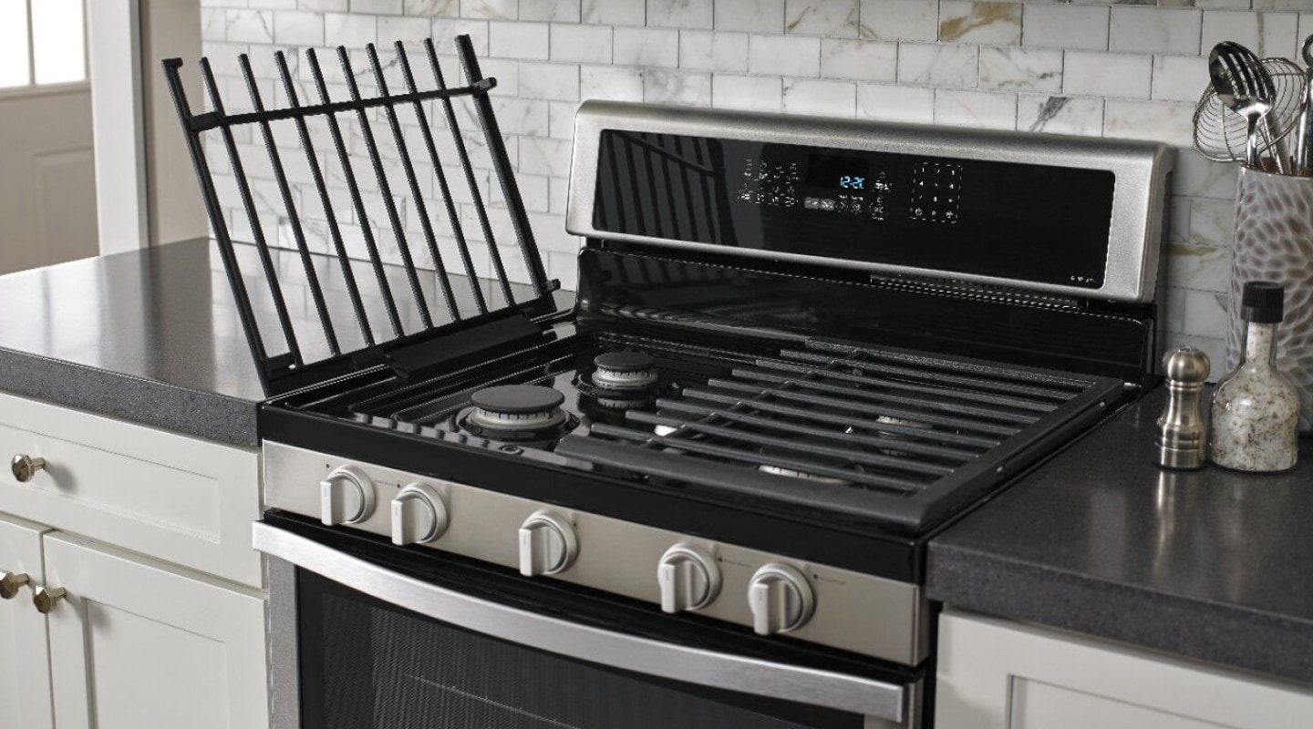 A slide-in range with the left grates lifted up. A slide-in range with the left grates lifted up.